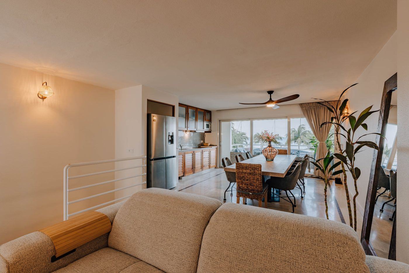 Living room with sofa, dining area and kitchen
